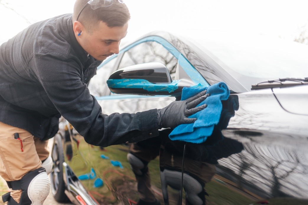 man cleaning the car